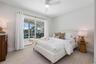 Bedroom 3 with sliding doors to the pool deck