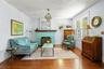 Large Living Room with Brick Painted Fireplace