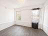 2nd fl  Wood-finish flooring with white walls and a textured lower wall panel