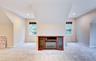 Carpeted bonus room with sloped ceilings and recessed lighting