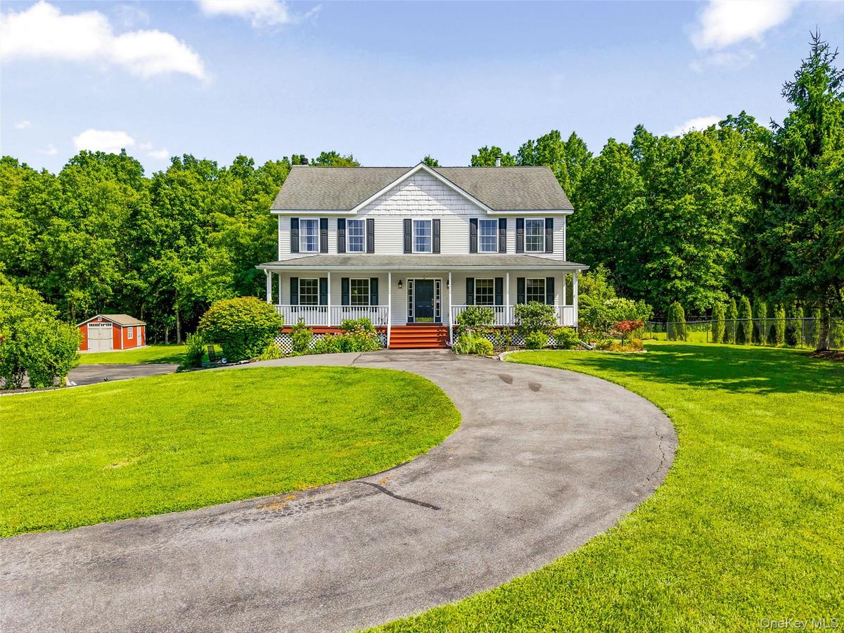 Front view with circular driveway.