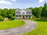 Front view with circular driveway.