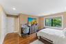 Hardwood flooring extending throughout the space