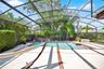 The screen-enclosed pool invites you to enjoy the Florida summer