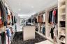 Master bedroom walk-in closet with dual access from bedroom or master bathroom