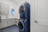 The laundry room has a full size fridge and storeage closet.