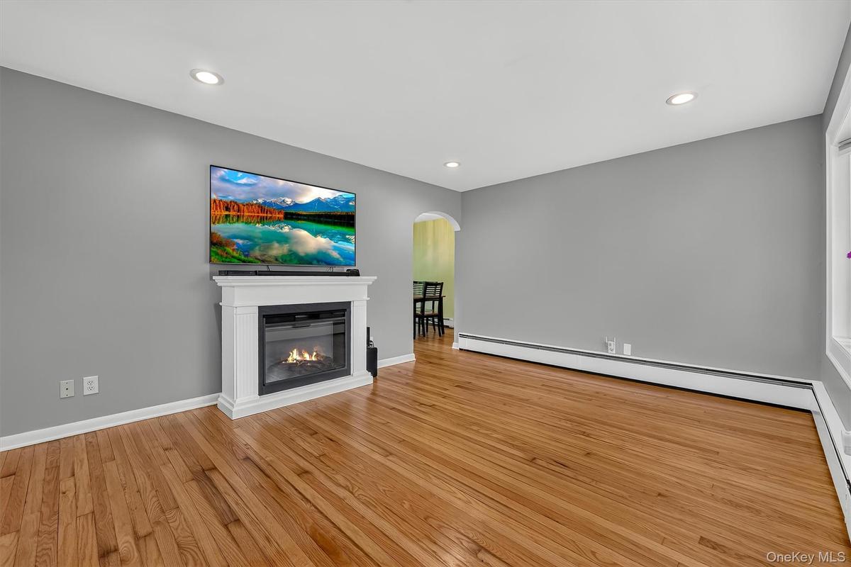 Open view from the living room into the dining room creates a comfortable flow between the main living spaces.