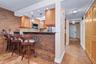 Beautifully tiled bar offers additional seating for 4+ people.