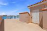 Spacious rooftop terrace with wide, open water views...absolutely lovely!! Door is elevator entry!