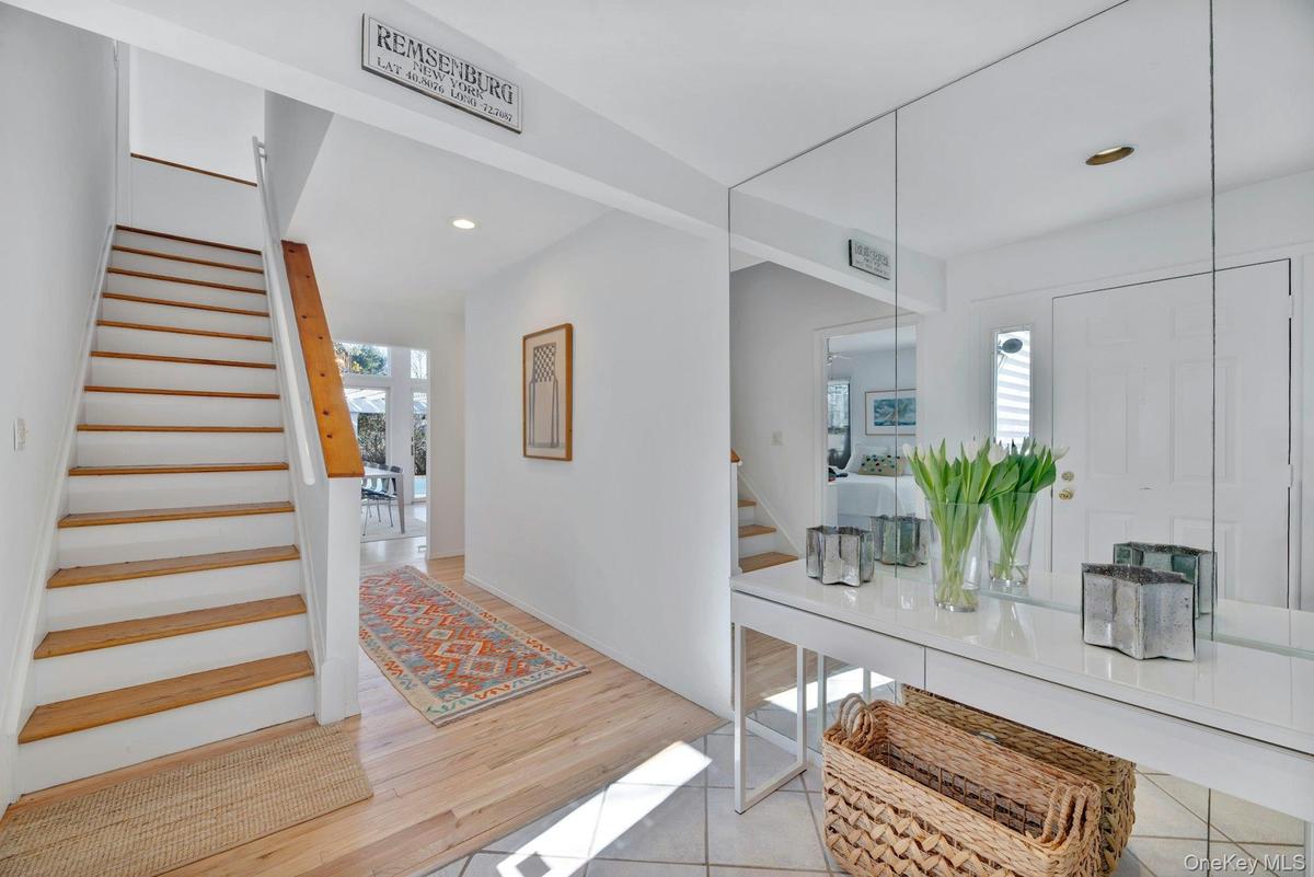 Foyer featuring recessed lighting, hard wood floors, and stairs to second floor sleeping area