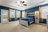 Spacious Primary Suite and the door leads to a balcony.