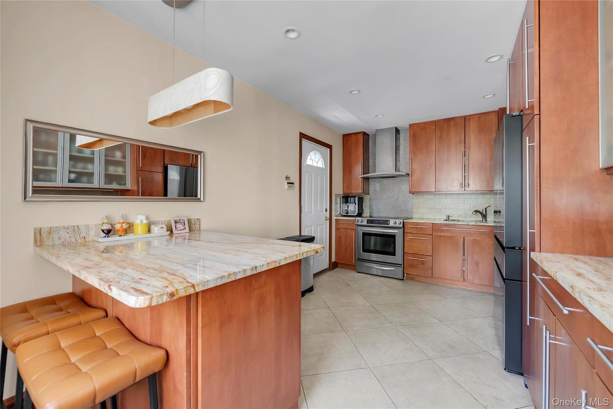 Eat in kitchen with custome made cabinet with granite countertop island new refrigerator dishwasher