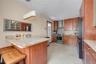 Eat in kitchen with custome made cabinet with granite countertop island new refrigerator dishwasher