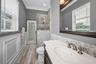 Pool bathroom w/custom cabinetry and glass walk-in shower