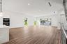 Natural light cascades throughout this exceptional corner unit