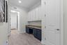 Butler's Pantry with built-in task desk and even more cabinets. 2nd pantry closet.
