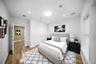 Bedroom with light wood-style flooring, recessed lighting, and a closet