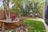 Stonewall Planter Box. A garden enthusiasts dream backyard.Mature landscaping and Stone Wall Feature