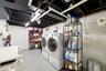 Spacious Laundry Room with Laundry Shoot & Storage