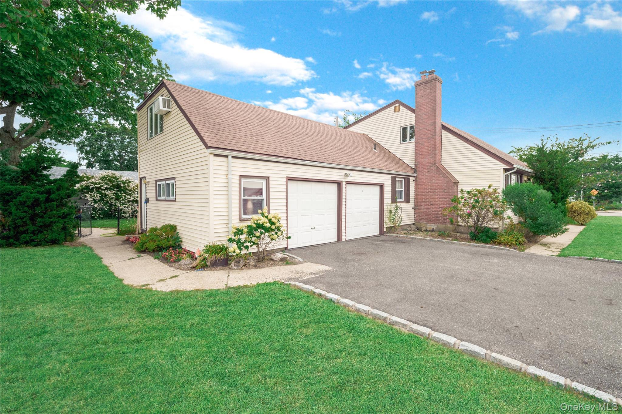 Side of Home showing garage and side entrance to backyard
