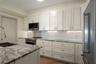 Designed with both style and practicality in mind, the kitchen offers exceptional storage.