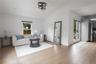 Living room with healthy amount of natural light and light wood-style flooring