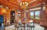 Dining room with french doors, wooden ceiling, wood walls, and wood finished floors