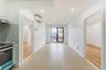 Kitchen with light wood-style floors, white cabinetry, a wall mounted air conditioner, stainless steel electric range oven, and recessed lighting