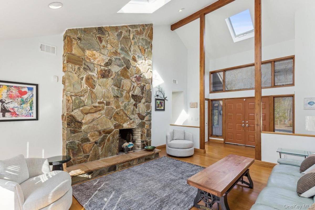 Living Room with Vaulted Ceiling and Fireplace - Photo 1