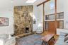 Living Room with Vaulted Ceiling and Fireplace - Photo 1