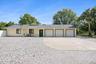 3 Car garage with New expanded gravel parking for RV/boat/trailer.