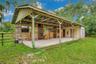 Barn with a tack and feed room plus extra storage nearby