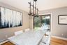 Dining area featuring a chandelier, light wood finished floors, and baseboard heating
