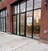 Property entrance with french doors and brick siding