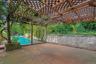 Outdoor pool with a patio area and a pergola