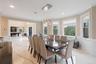 Dining room with light marble finish flooring, ornamental molding, a chandelier, wainscoting, and recessed lighting