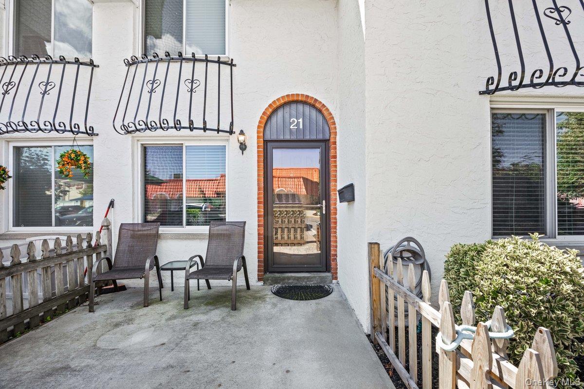 Arched brick entry with a glass-paneled door