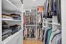 Gorgeous custom walk in closet in primary bedroom
