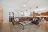 Big family room with beverage bar overlooks the pool patio