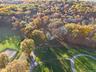 Aerial view of property's location with a forest