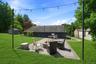 A welcoming patio space that seamlessly blends relaxation and entertaining, perfect for weekend cookouts.
