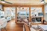 Interior featuring wood-finish flooring, exposed wood beams, and a wood plank ceiling