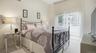 Queen bed, with sliding doors to yard & pool.