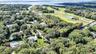 Aerial view of property's location featuring property boundaries highlighted and a large body of water