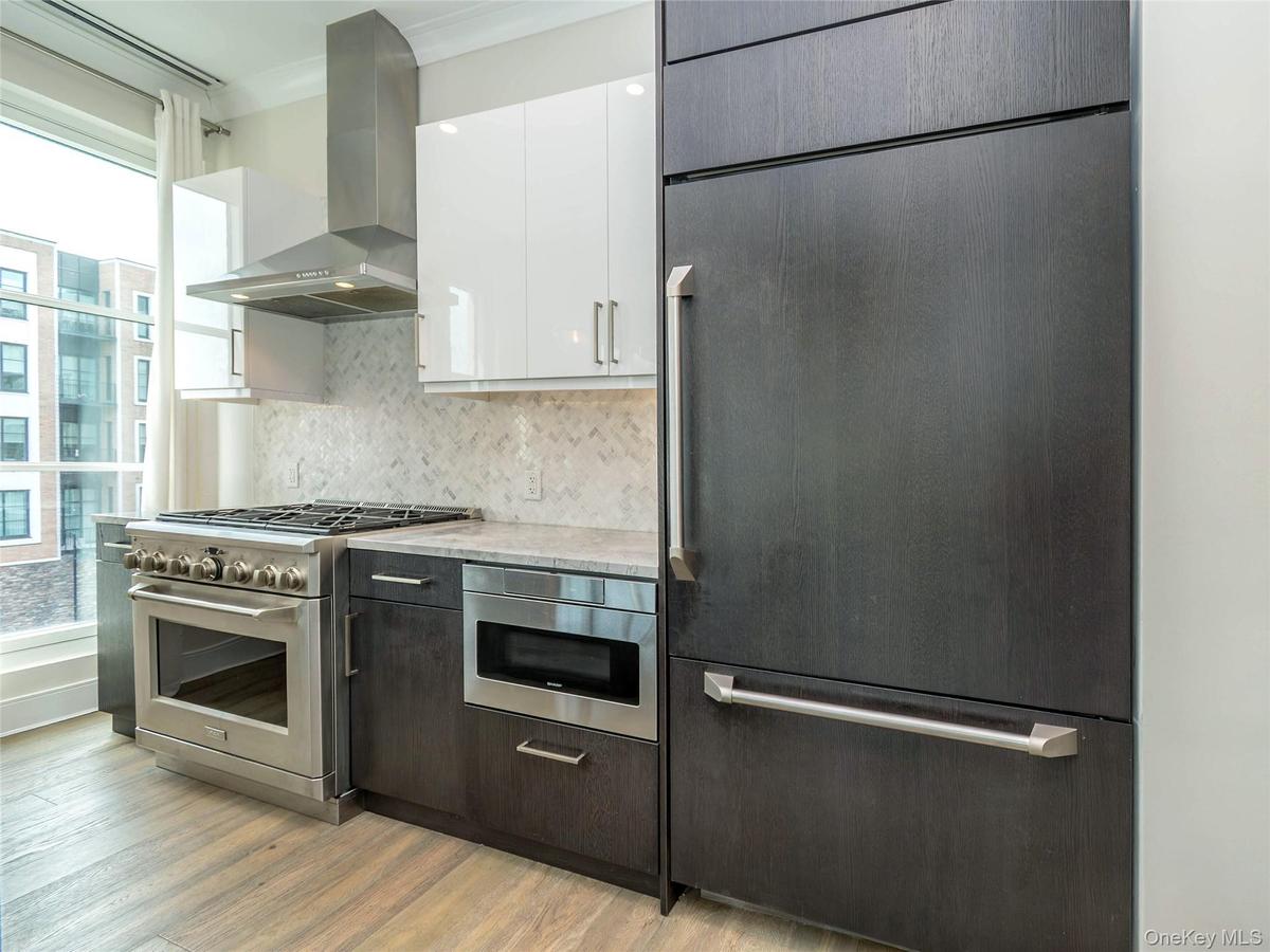 Italian made Custom Cabinetry. Stove with 6 Gas Burners and Fully Vented Out Range Hood