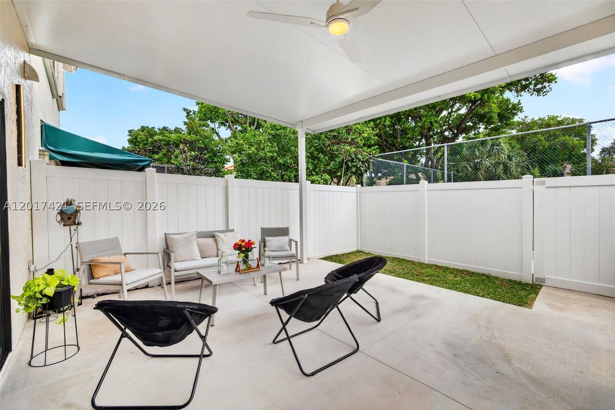 Amazing covered patio w/ new PVC fence, backs up to the pool area (& tennis which is currently closed) for the community. Plenty of room for hot tub o