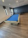 Recreation room with recessed lighting and pool table