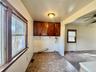 6 - Laundry room featuring carpet flooring, hookup for a washing machine, visible vents, a ceiling fan, and cabinet space