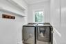 Separate laundry room has a door you can close!