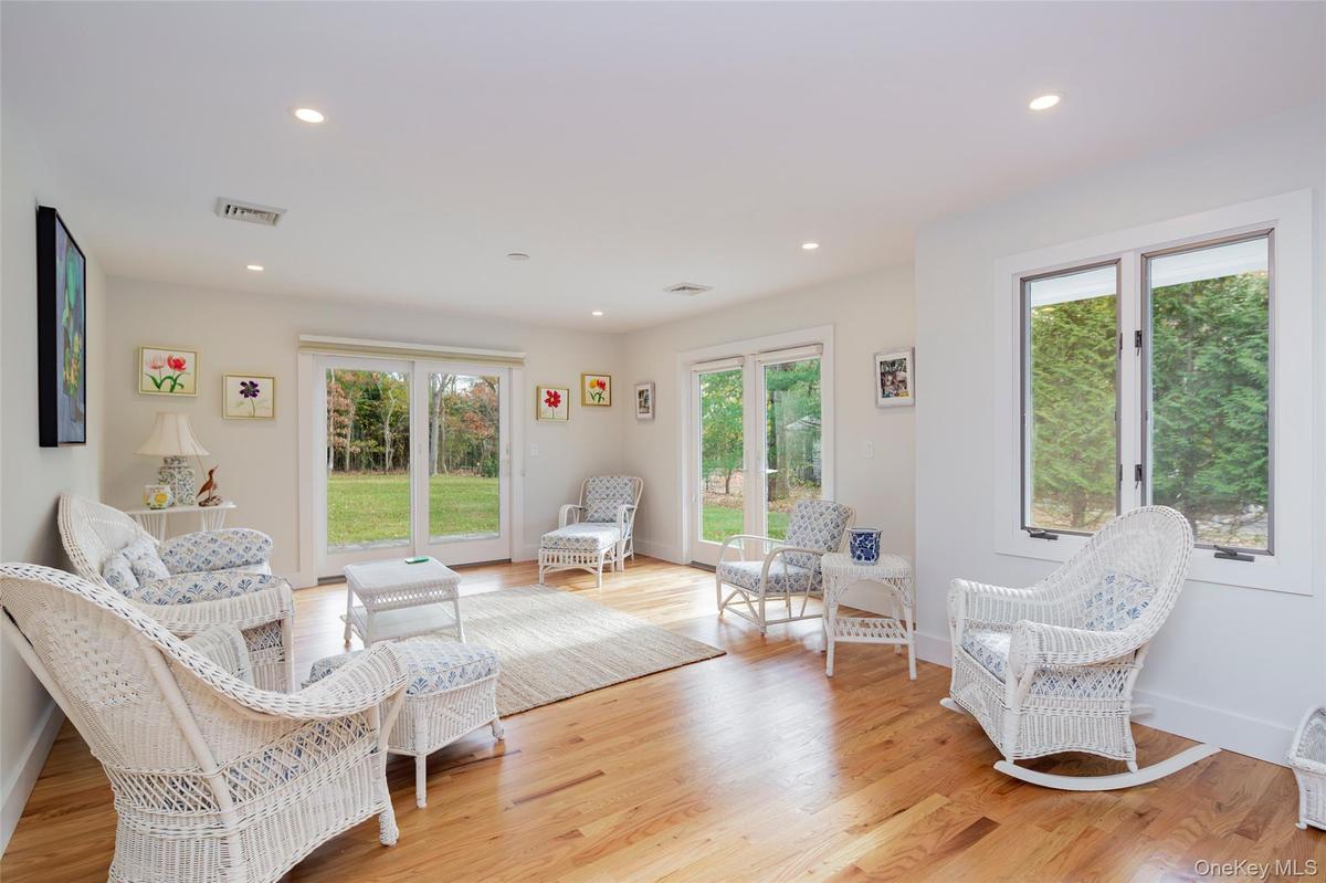 Sitting room featuring recessed lighting, plenty of natural light, and light wood finished floors